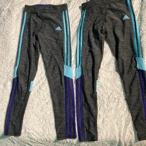 2 Adidas girls leggings With blue and purple side stripes. Both Size M 10/12